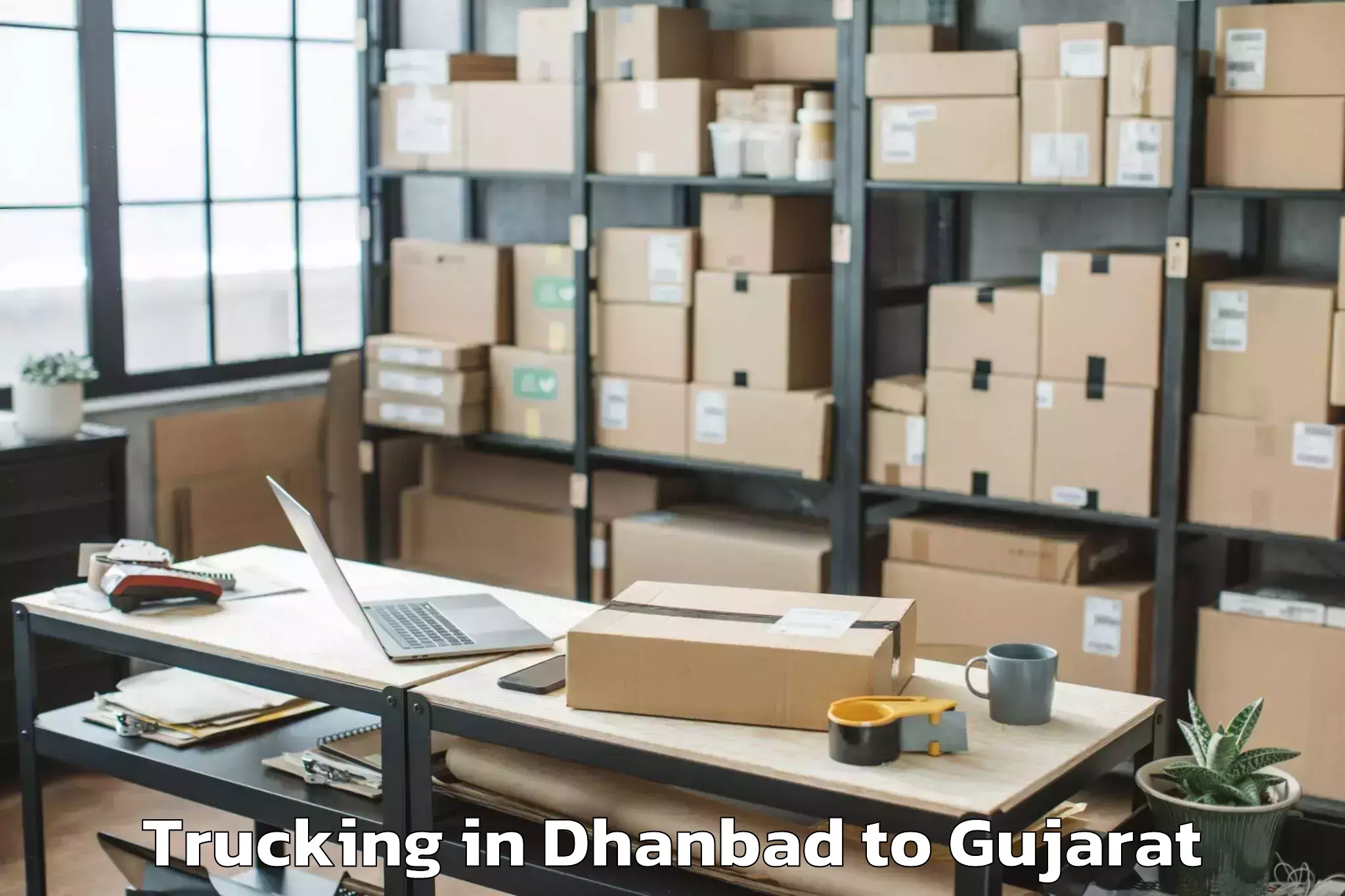 Top Dhanbad to Kodinar Trucking Available